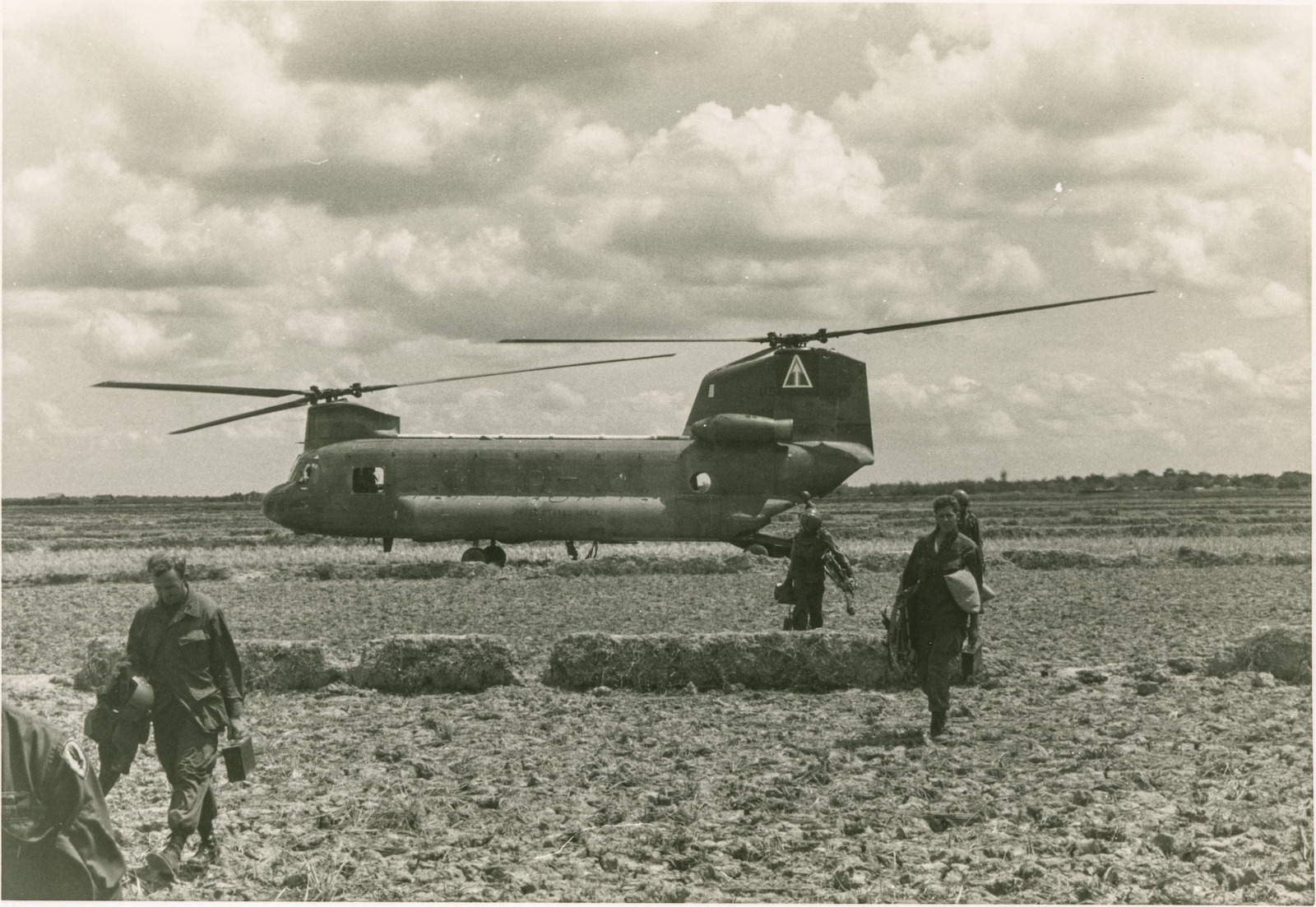 Captain Andrew Craig RAN photograph of people walking from a helicopter
