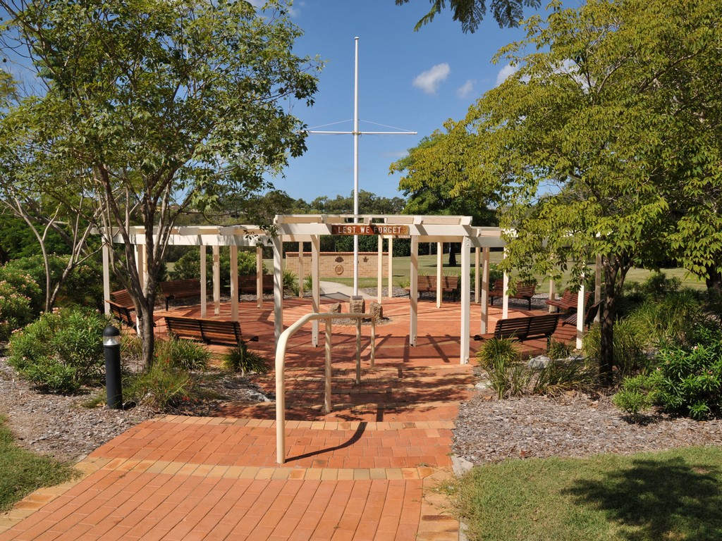 Stirling Park Anzac Memorial with the Veterans Memorial wall beyond the concrete pathway.