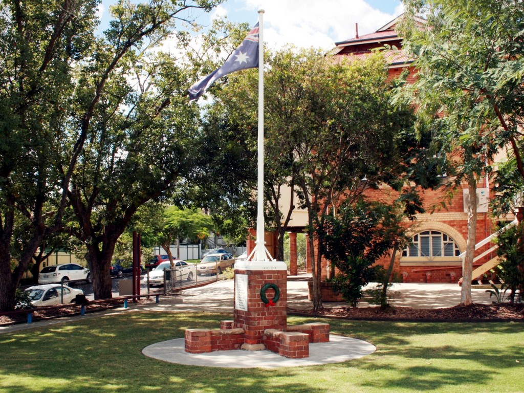 New Farm State School War Memorial - setting with school classrooms behind.
