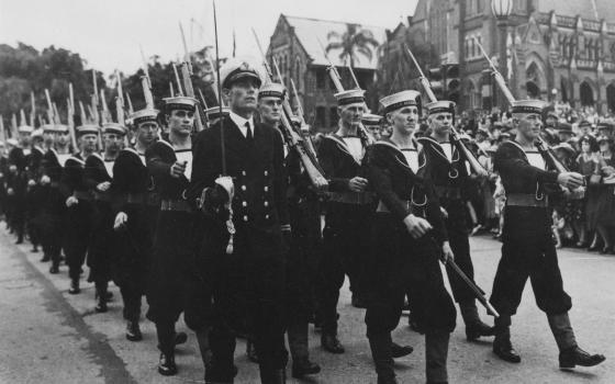 Old photograph of men marching in Anzac Day parade.