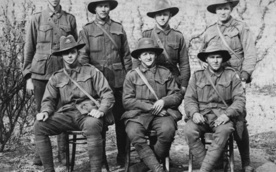Portrait of seven Australian soldiers outside during World War One. 