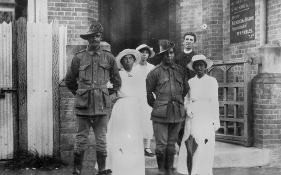 A double wedding of two first nations WW1 servicemen to their wives outside a church.