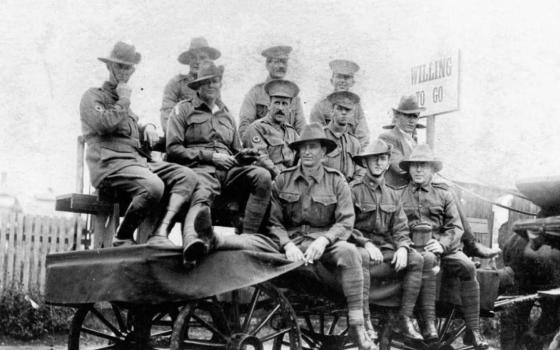 Old photograph of WWI recruits on a parade float in Brisbane with a sign that says "Willing To Go".