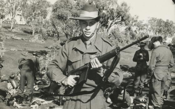 Soldier standing holding gun