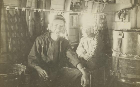 RAAF airman Jon Fallows with another serviceman, inside a military plane, Vietnam. 1968-1969.